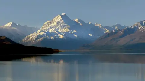 Image Compressor on a landscape: 147.8 KB → 48.3 KB (−67%)